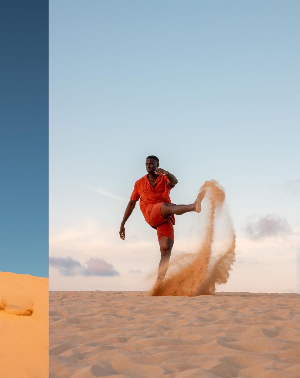 Man kicking sand