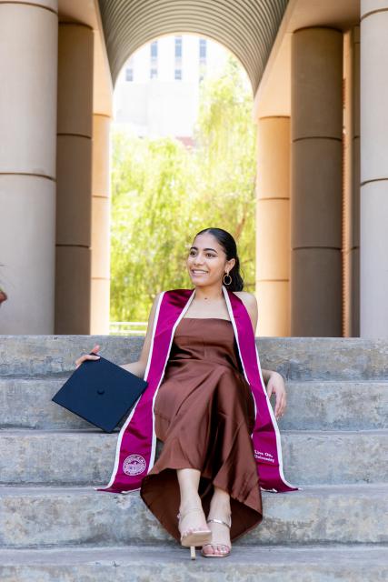 Student with graduation stoll and cap 