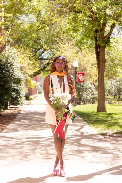 Student with graduation stoll and cap 