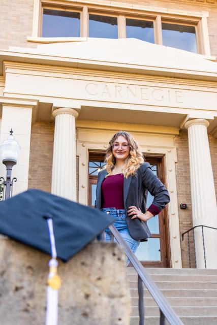 Student with graduation stoll and cap 