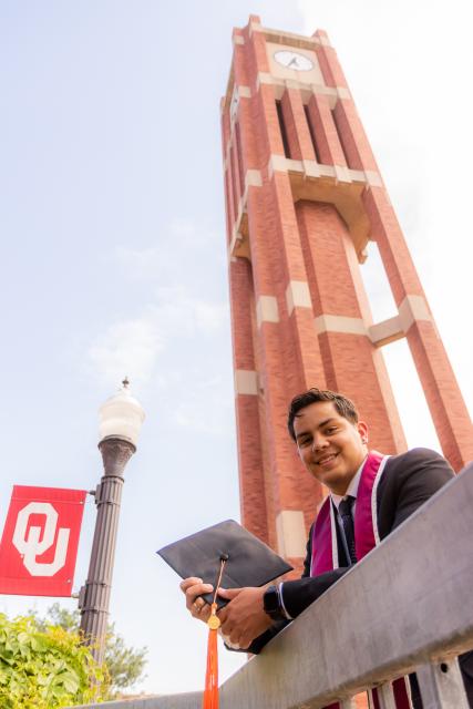 Student with graduation stoll and cap 