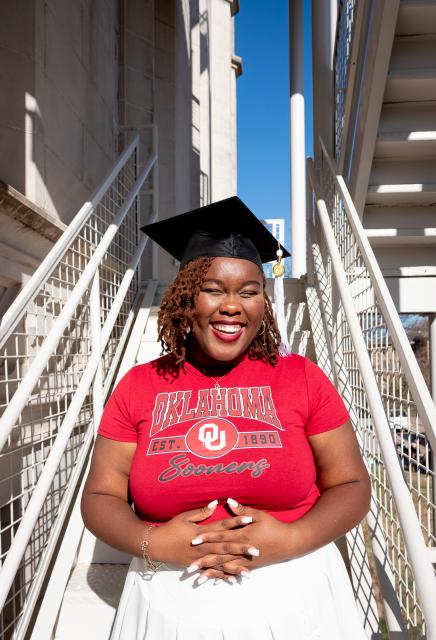 Student with graduation stoll and cap 