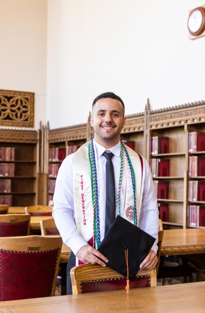 Student with graduation stoll and cap 